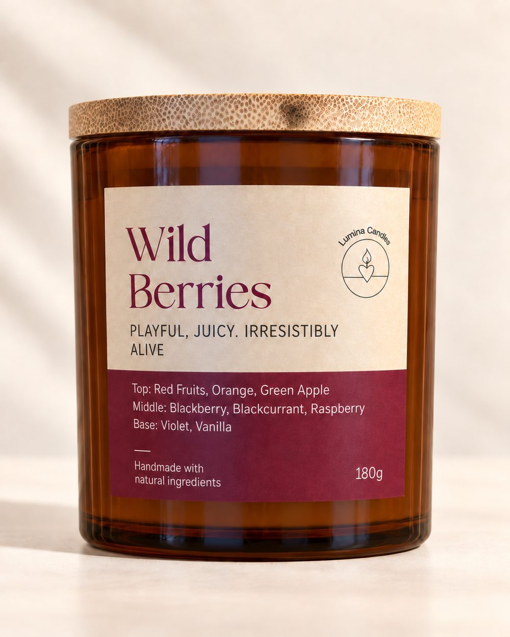 Lumina amber glass candle with a wooden lid and a 'Wild Berries' label