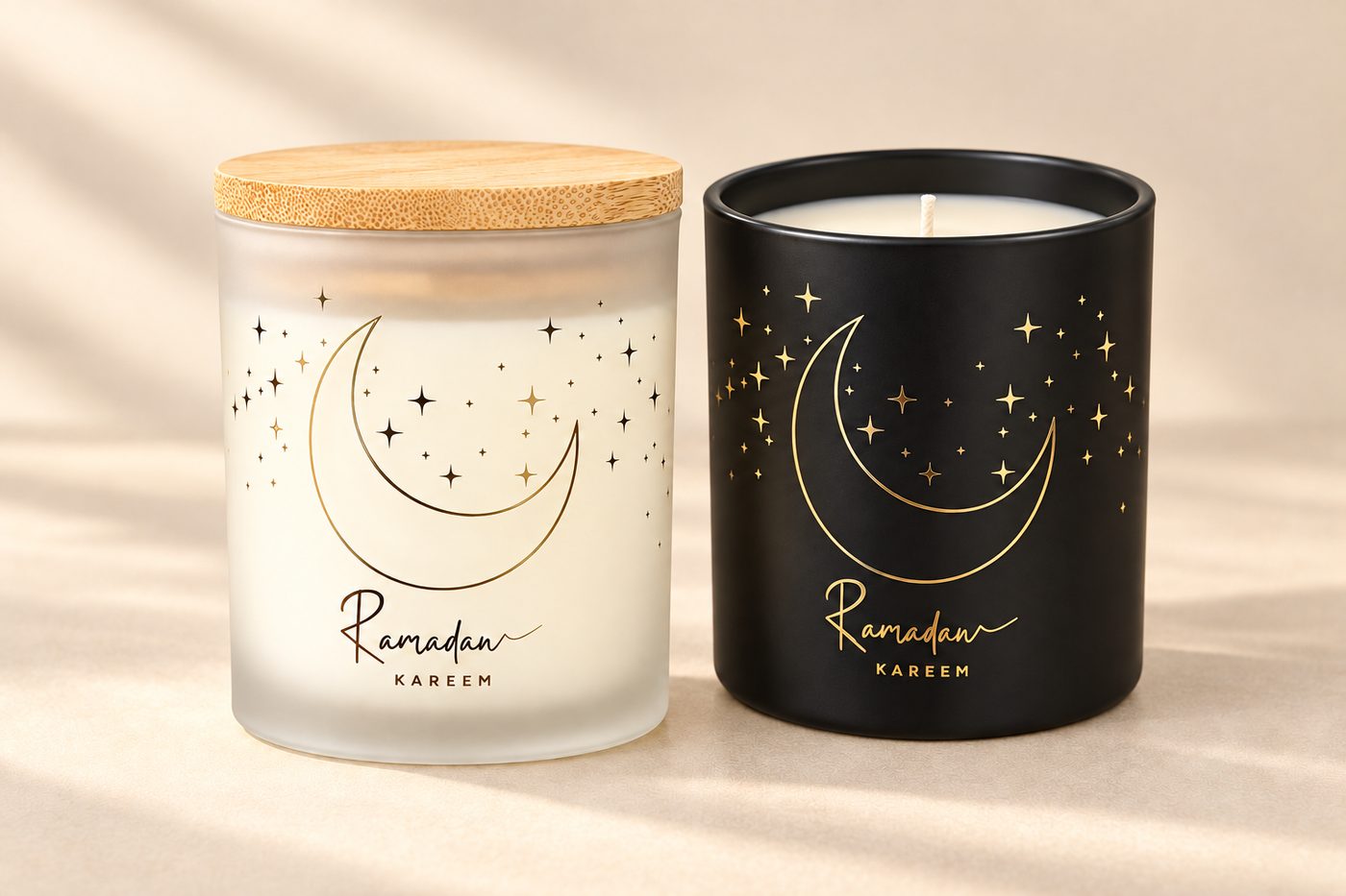 Two Ramadan Kareem candles with crescent and stars, frosted and matte black